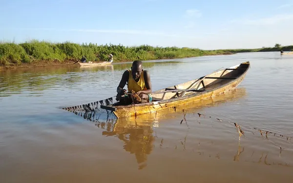 Fisherman working in a riverboat